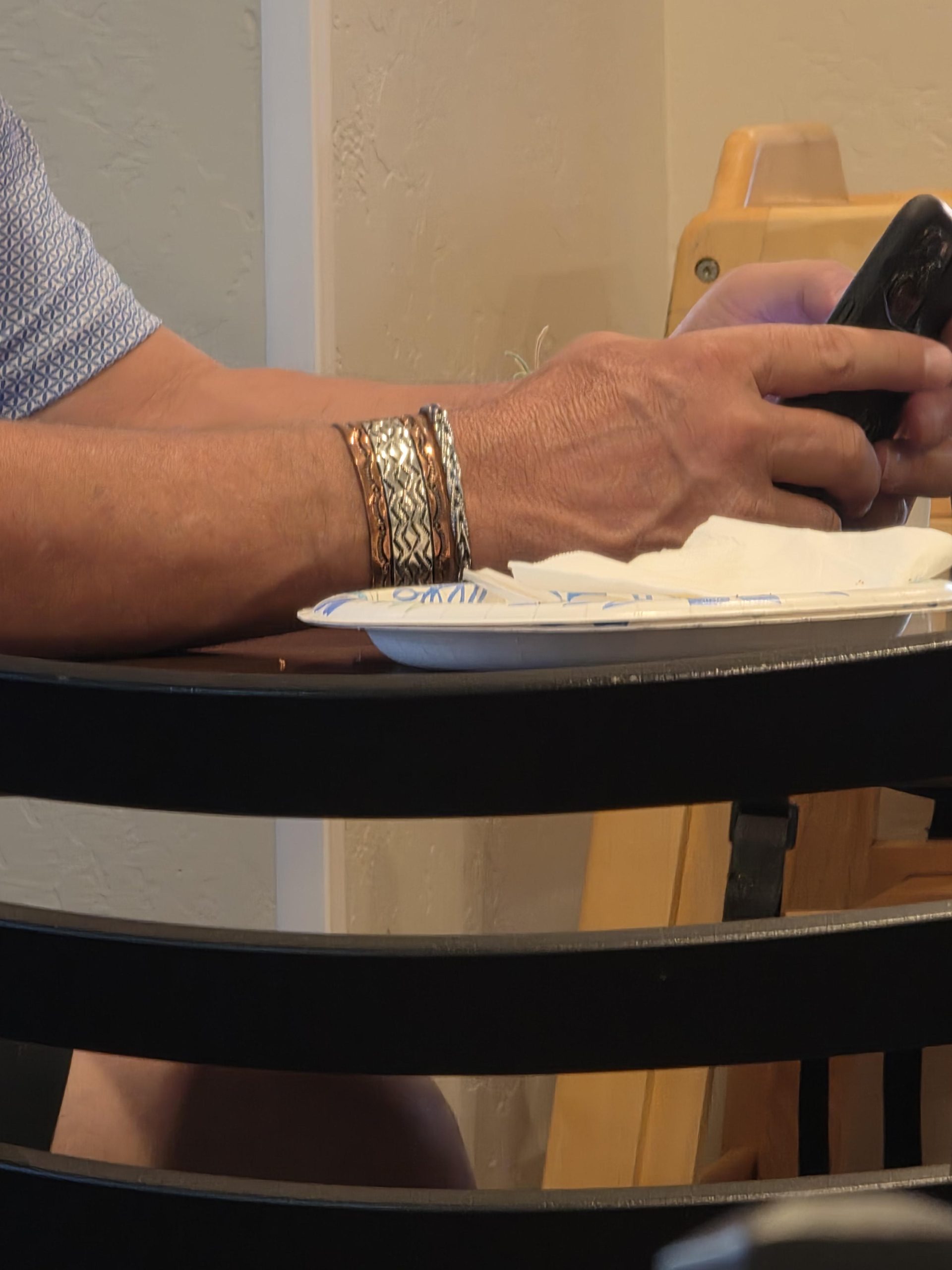 Why Is Everyone Wearing This Metallic Cuff? The Story Behind the Wrist Band