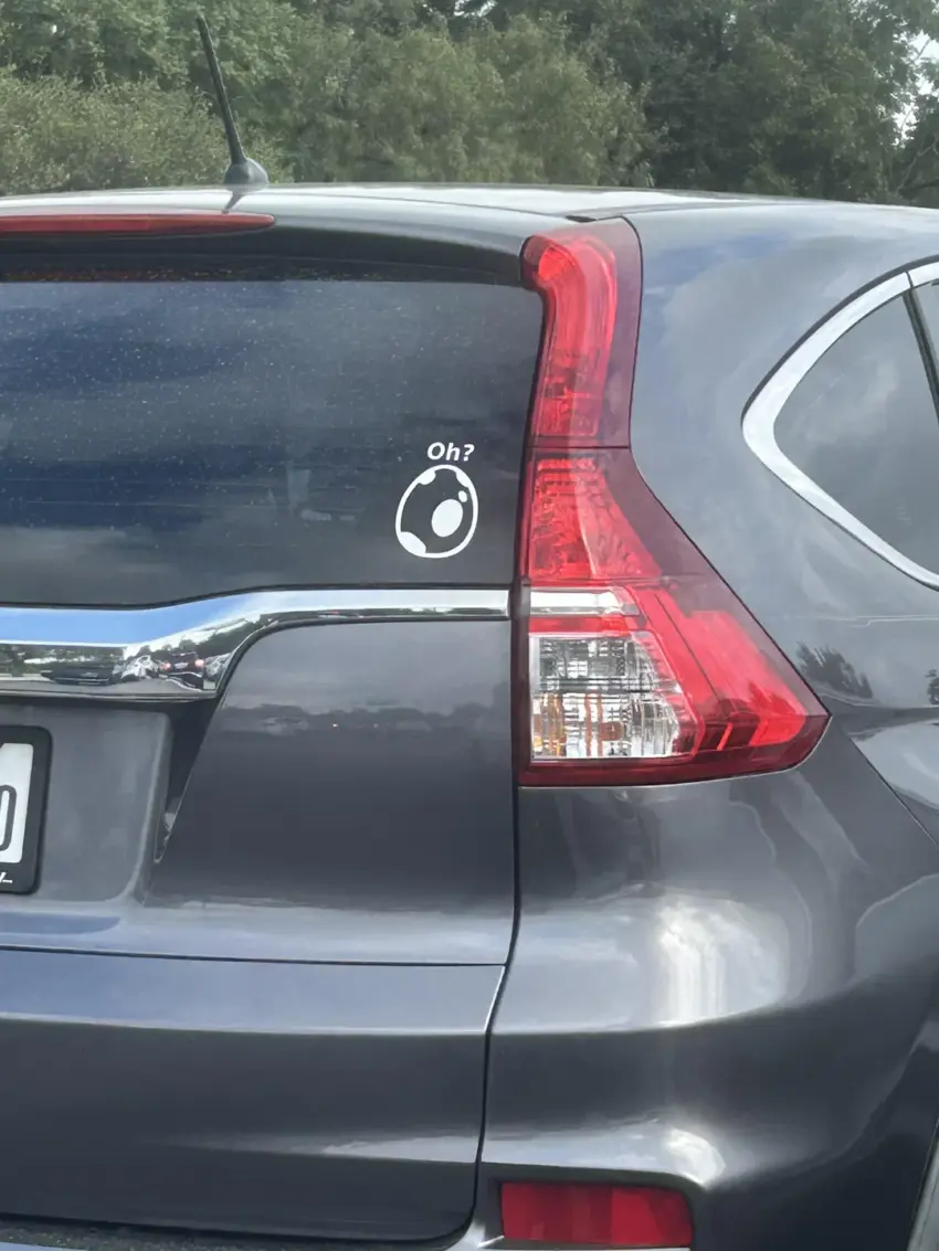 What Is That “Oh?” Egg Decal on Cars?